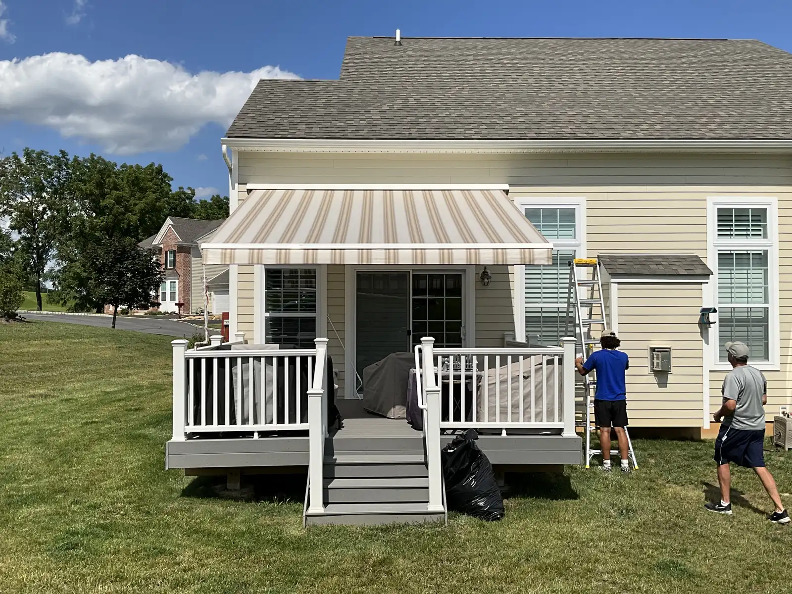 The Designer Awnings crew finishing an awning installation